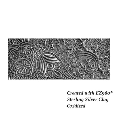 silver sample of Mega Texture Tile - Waves of Paisley. Use to impress texture in soft clays. Mega Texture Tiles are perfect for projects both large and small. Mega Tiles measure 9-1/4" x 6" and are about 7 times larger than Texture Tiles. These textures are flexible, washable and can be used with any soft clay.