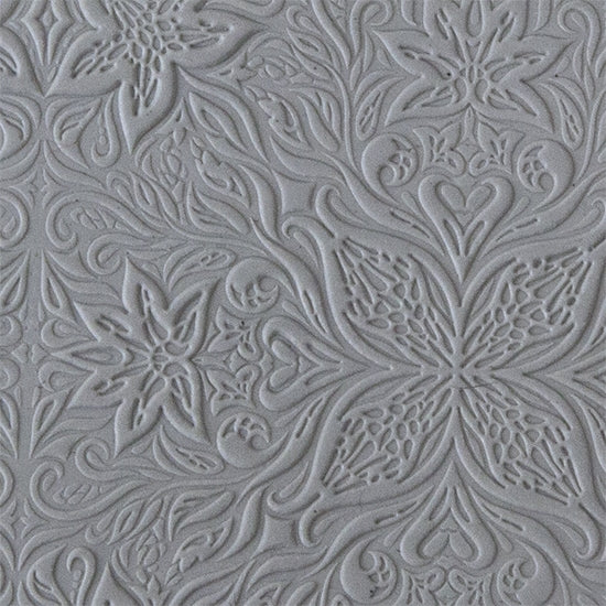 sample in clay of Mega Texture Tile - Woodcut Floral Embossed. Use to impress texture in soft clays. Mega Texture Tiles are perfect for projects both large and small. Mega Tiles measure 9-1/4" x 6" and are about 7 times larger than Texture Tiles. These textures are flexible, washable and can be used with any soft clay.