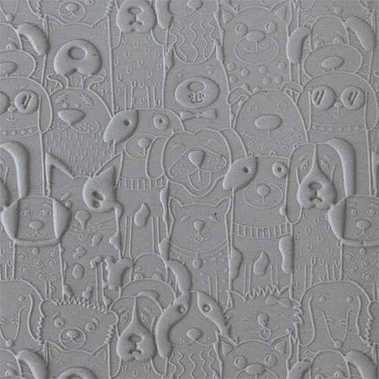 sample in clay of Canine Companions Embossed. Use to impress texture in soft clays. Mega Texture Tiles are perfect for projects both large and small. Mega Tiles measure 9-1/4" x 6" and are about 7 times larger than Texture Tiles. These textures are flexible, washable and can be used with any soft clay.