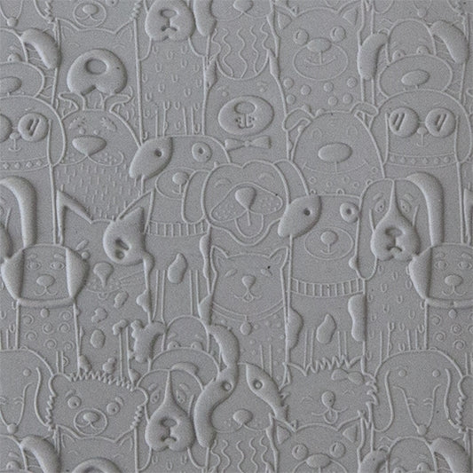 sample in clay of Canine Companions Embossed. Use to impress texture in soft clays. Mega Texture Tiles are perfect for projects both large and small. Mega Tiles measure 9-1/4" x 6" and are about 7 times larger than Texture Tiles. These textures are flexible, washable and can be used with any soft clay.