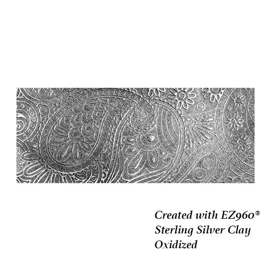 silver sample of Mega Texture Tile - Waves of Paisley Embossed. Use to impress texture in soft clays. Mega Texture Tiles are perfect for projects both large and small. Mega Tiles measure 9-1/4" x 6" and are about 7 times larger than Texture Tiles. These textures are flexible, washable and can be used with any soft clay.