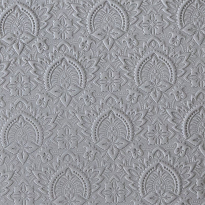 sample in clay of Mega Texture Tile - Blossom Badge. Use to impress texture in soft clays. Mega Texture Tiles are perfect for projects both large and small. Mega Tiles measure 9-1/4" x 6" and are about 7 times larger than Texture Tiles. These textures are flexible, washable and can be used with any soft clay.