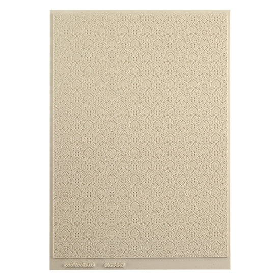 Mega Texture Tile - Blossom Badge. Use to impress texture in soft clays. Mega Texture Tiles are perfect for projects both large and small. Mega Tiles measure 9-1/4" x 6" and are about 7 times larger than Texture Tiles. These textures are flexible, washable and can be used with any soft clay.