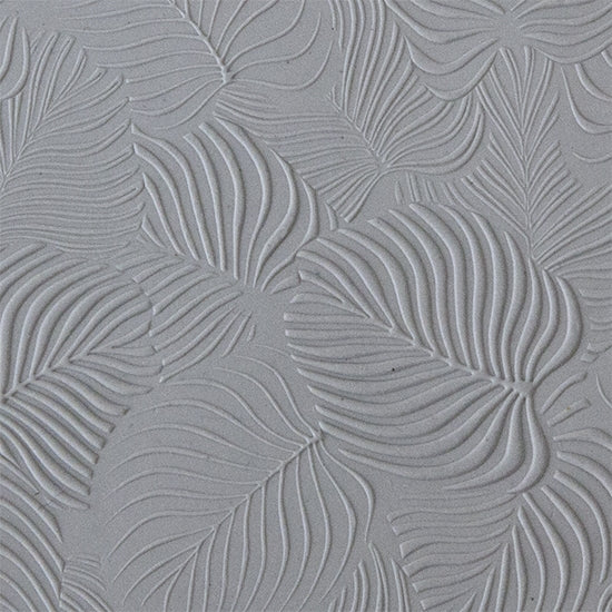 sample in clay of Mega Texture Tile - In the Tropics. Use to impress texture in soft clays. Mega Texture Tiles are perfect for projects both large and small. Mega Tiles measure 9-1/4" x 6" and are about 7 times larger than Texture Tiles. These textures are flexible, washable and can be used with any soft clay.