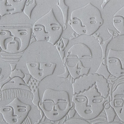sample in clay of Mega Texture Tile - A Face in the Crowd Use to impress texture in soft clays. Mega Texture Tiles are perfect for projects both large and small. Mega Tiles measure 9-1/4" x 6" and are about 7 times larger than Texture Tiles. These textures are flexible, washable and can be used with any soft clay.