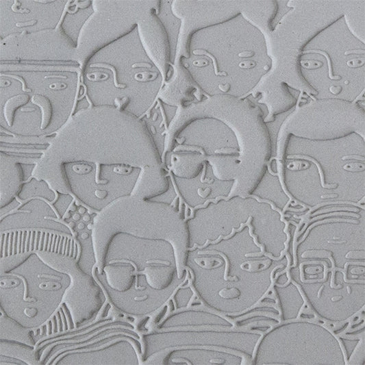 sample in clay of Mega Texture Tile - A Face in the Crowd Embossed First picture shown in texture in clay.  Use to impress texture in soft clays. Mega Texture Tiles are perfect for projects both large and small. Mega Tiles measure 9-1/4" x 6" and are about 7 times larger than Texture Tiles. These textures are flexible, washable and can be used with any soft clay.