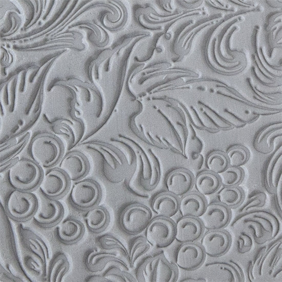 sample in clay of Mega Texture Tile - Tuscany Dreams. Use to impress texture in soft clays. Mega Texture Tiles are perfect for projects both large and small. Mega Tiles measure 9-1/4" x 6" and are about 7 times larger than Texture Tiles. These textures are flexible, washable and can be used with any soft clay.