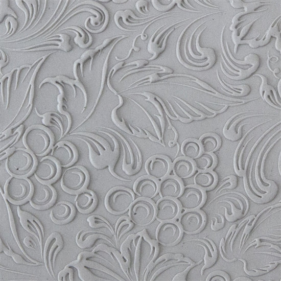 sample in clay of Mega Texture Tile - Tuscany Dreams Embossed. Use to impress texture in soft clays. Mega Texture Tiles are perfect for projects both large and small. Mega Tiles measure 9-1/4" x 6" and are about 7 times larger than Texture Tiles. These textures are flexible, washable and can be used with any soft clay.