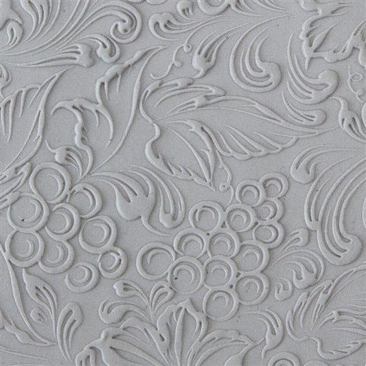 sample in clay of Mega Texture Tile - Tuscany Dreams Embossed. Use to impress texture in soft clays. Mega Texture Tiles are perfect for projects both large and small. Mega Tiles measure 9-1/4" x 6" and are about 7 times larger than Texture Tiles. These textures are flexible, washable and can be used with any soft clay.