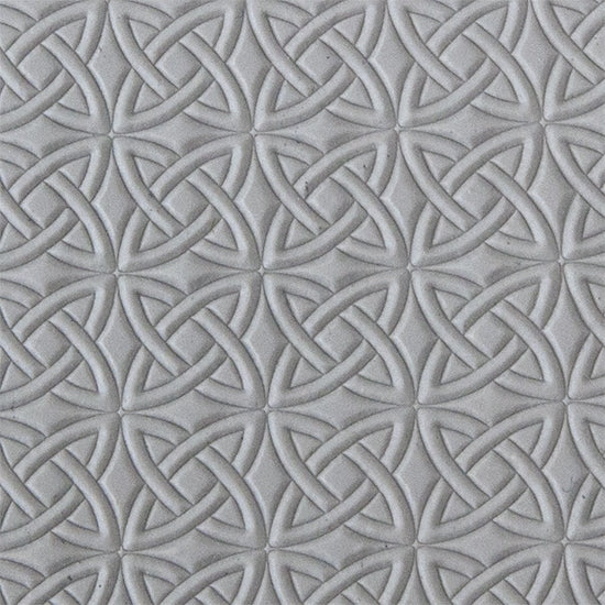 sample in clay of Mega Texture Tile - Celtic Over & Under. Use to impress texture in soft clays. Mega Texture Tiles are perfect for projects both large and small. Mega Tiles measure 9-1/4" x 6" and are about 7 times larger than Texture Tiles. These textures are flexible, washable and can be used with any soft clay.