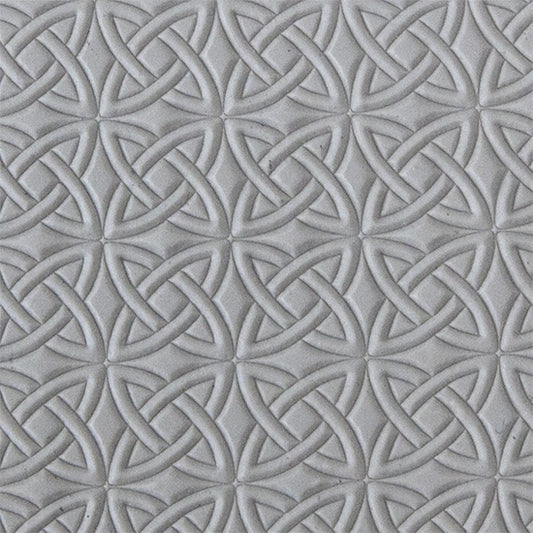 sample in clay of Mega Texture Tile - Celtic Over & Under. Use to impress texture in soft clays. Mega Texture Tiles are perfect for projects both large and small. Mega Tiles measure 9-1/4" x 6" and are about 7 times larger than Texture Tiles. These textures are flexible, washable and can be used with any soft clay.