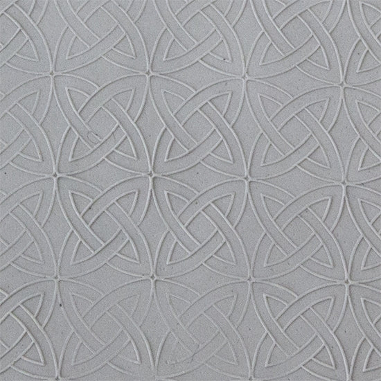 sample in clay of Mega Texture Tile - Celtic Over & Under Fineline. Use to impress texture in soft clays. Mega Texture Tiles are perfect for projects both large and small. Mega Tiles measure 9-1/4" x 6" and are about 7 times larger than Texture Tiles. These textures are flexible, washable and can be used with any soft clay.