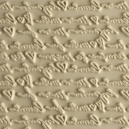 Mega Texture Tile - Sincerely Yours. Use to impress texture in soft clays. Mega Texture Tiles are perfect for projects both large and small. Mega Tiles measure 9-1/4" x 6" and are about 7 times larger than Texture Tiles. These textures are flexible, washable and can be used with any soft clay.