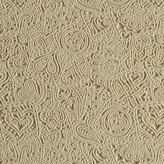 Mega Texture Tile - Doodling Hearts. Use to impress texture in soft clays. Mega Texture Tiles are perfect for projects both large and small. Mega Tiles measure 9-1/4" x 6" and are about 7 times larger than Texture Tiles. These textures are flexible, washable and can be used with any soft clay.