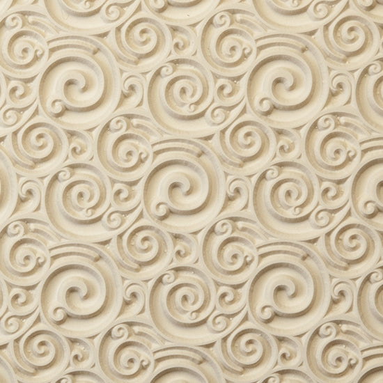 Rollable Texture Tile - Curly Spirals. Rollable Texture Tiles measure 4" x 5-1/2" overall and have a textured area of 2-3/8" x 4-7/8"; perfect for larger projects. Each texture has a shoulder that allows one of our Clay Thickness Rolling Frames to sit directly on the texture for rolling. Rollable Texture Tiles are flexible, washable and can be used with any soft clay. Spritz with CoolSlip or dust on Dry Powder Release for stick-free impressions when using metal clay and polymer clay.