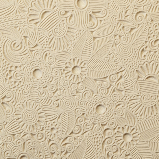 Rollable Texture Tile - Flower Party. Rollable Texture Tiles measure 4" x 5-1/2" overall and have a textured area of 2-3/8" x 4-7/8"; perfect for larger projects. Each texture has a shoulder that allows one of our Clay Thickness Rolling Frames to sit directly on the texture for rolling. Rollable Texture Tiles are flexible, washable and can be used with any soft clay. Spritz with CoolSlip or dust on Dry Powder Release for stick-free impressions when using metal clay and polymer clay.