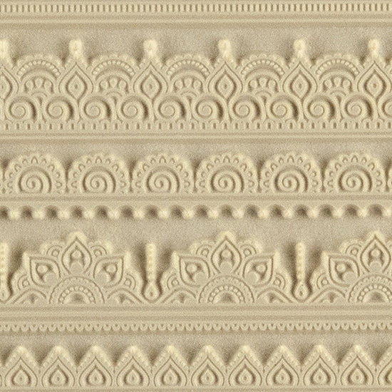 Rollable Texture Tile - Mehndi Borders. Rollable Texture Tiles measure 4" x 5-1/2" overall and have a textured area of 2-3/8" x 4-7/8"; perfect for larger projects. Each texture has a shoulder that allows one of our Clay Thickness Rolling Frames to sit directly on the texture for rolling. Rollable Texture Tiles are flexible, washable and can be used with any soft clay. Spritz with CoolSlip or dust on Dry Powder Release for stick-free impressions when using metal clay and polymer clay.