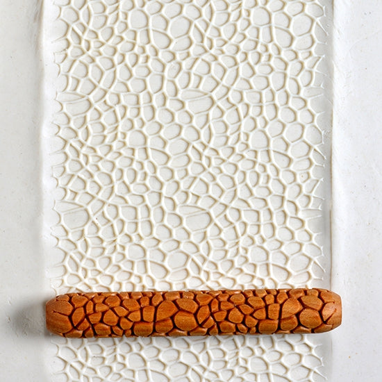 Wooden Hand Roller - Bubbles rolled into white clay