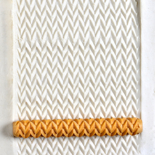 Wooden Hand Roller - Zigzag rolled into white clay