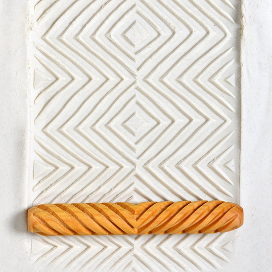 Wooden Hand Roller - Square Pop Art rolled into white clay