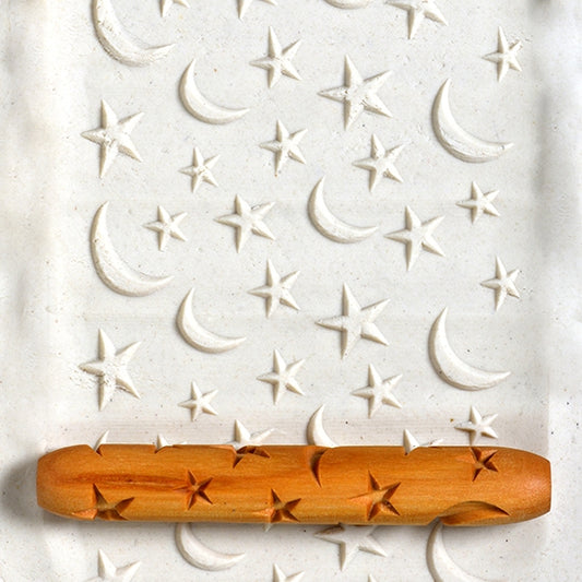 Wooden Hand Roller - Stars and Moons rolled into white clay