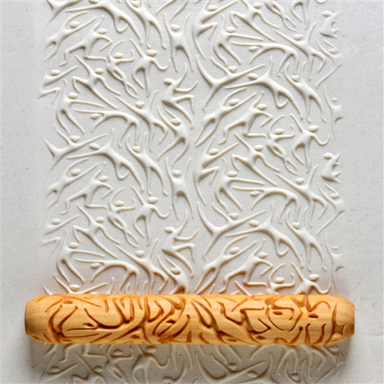 Wooden Hand Roller - Dancing rolled into white clay