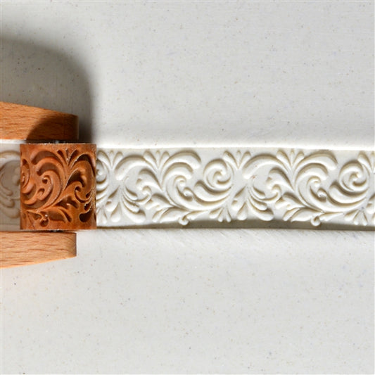 Wooden Mini Roller - Rococo 20mm rolled into white clay