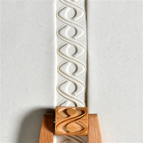 Wooden Mini Roller - Double Helix 20mm rolled into white clay