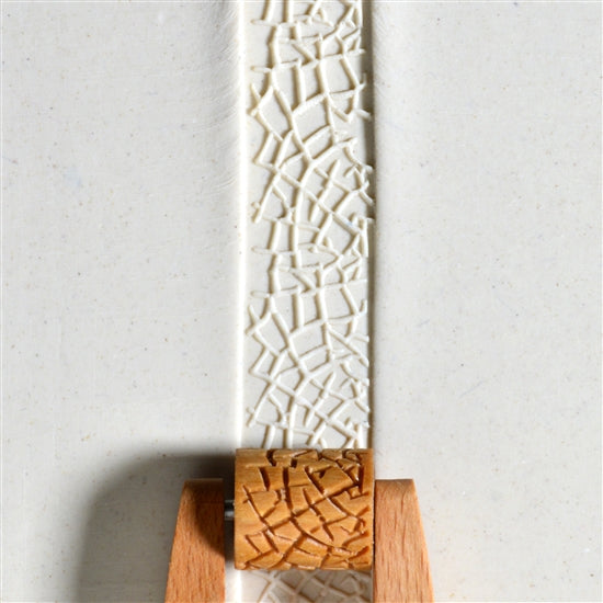 Wooden Mini Roller - Cracked 20mm rolled into white clay