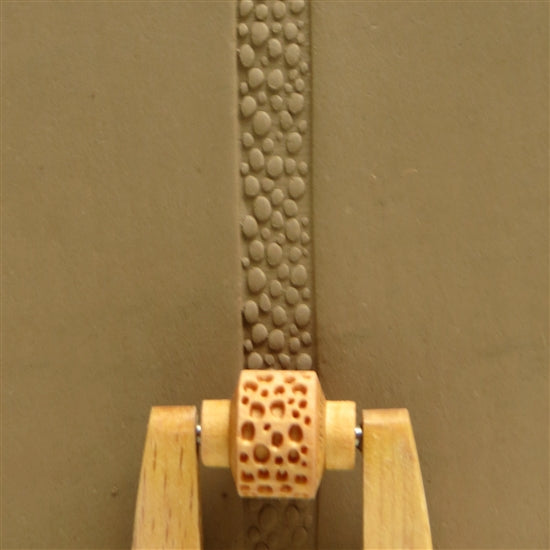 Wooden Mini Roller - Pebbles 10mm rolled into clay