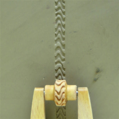 Wooden Mini Roller - Zebra Stripes 5mm rolled into clay