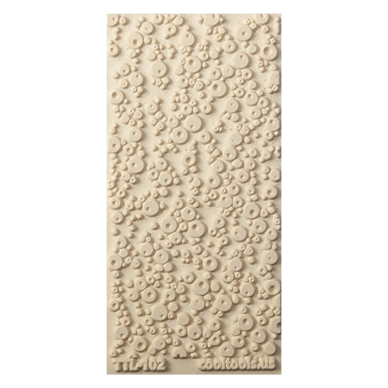 Texture Tile - Double Bubble. Beige Texture Tiles are flexible, washable and can be used with any soft clay. Spritz with CoolSlip or dust on Dry Powder Release for stick-free impressions when using metal clay and polymer clay.