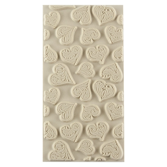 Texture Tile - Heartbreaker. Beige Texture Tiles are flexible, washable and can be used with any soft clay. Spritz with CoolSlip or dust on Dry Powder Release for stick-free impressions when using metal clay and polymer clay.