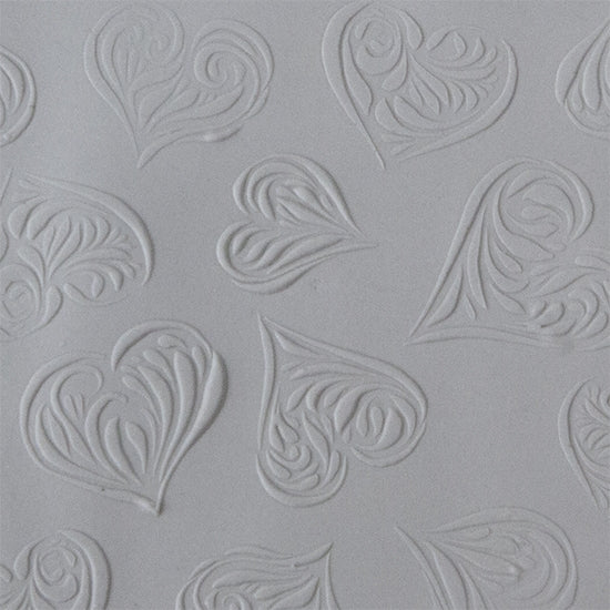 Texture Tile - Heartbreaker Embossed sample rolled into clay