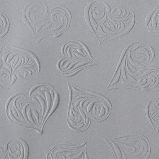 Texture Tile - Heartbreaker Embossed sample rolled into clay