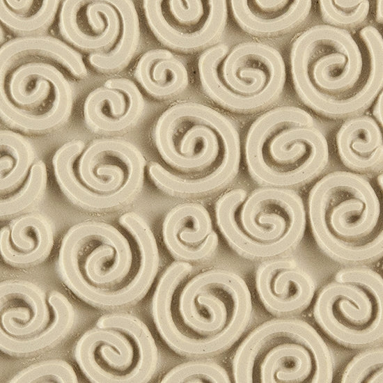 Texture Tile - Spirals. Beige Texture Tiles are flexible, washable and can be used with any soft clay. Spritz with CoolSlip or dust on Dry Powder Release for stick-free impressions when using metal clay and polymer clay.