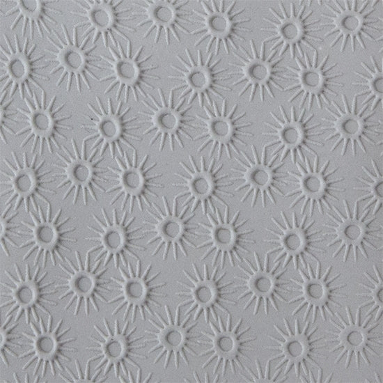 Texture Tile - Starburst Embossed sample rolled into clay