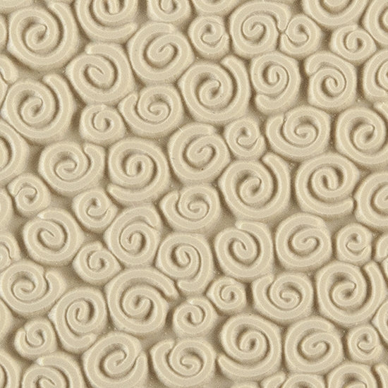 Texture Tile - Spirals Mini. Beige Texture Tiles are flexible, washable and can be used with any soft clay. Spritz with CoolSlip or dust on Dry Powder Release for stick-free impressions when using metal clay and polymer clay.