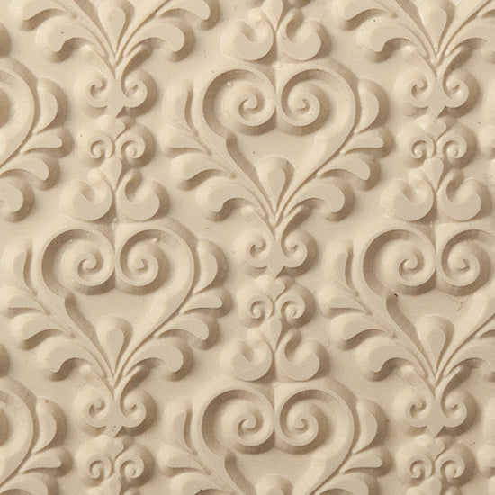 Texture Tile - My Sweetheart. Beige Texture Tiles are flexible, washable and can be used with any soft clay. Spritz with CoolSlip or dust on Dry Powder Release for stick-free impressions when using metal clay and polymer clay.