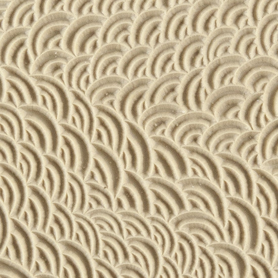 Texture Tile - Scaled. Beige Texture Tiles are flexible, washable and can be used with any soft clay. Spritz with CoolSlip or dust on Dry Powder Release for stick-free impressions when using metal clay and polymer clay.