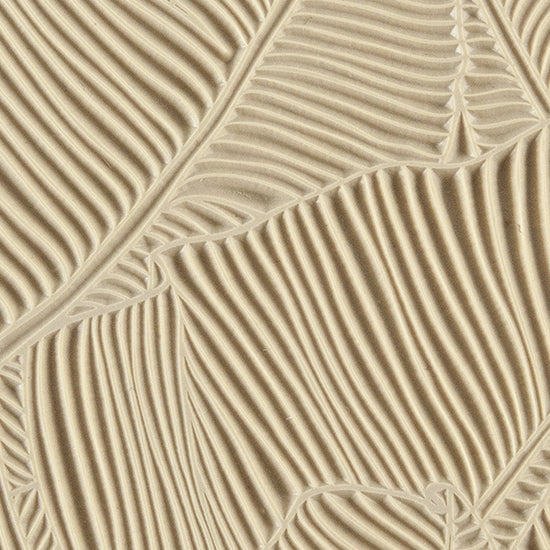 Texture Tile - Jungle Leaves. Beige Texture Tiles are flexible, washable and can be used with any soft clay. Spritz with CoolSlip or dust on Dry Powder Release for stick-free impressions when using metal clay and polymer clay.