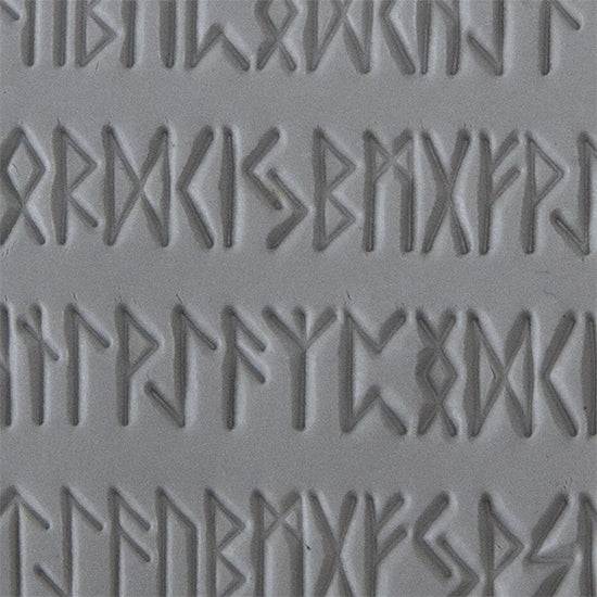 Texture Tile - Cave Writing sample rolled into clay