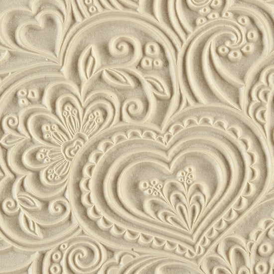 Texture Tile - Blooming Hearts. Beige Texture Tiles are flexible, washable and can be used with any soft clay. Spritz with CoolSlip or dust on Dry Powder Release for stick-free impressions when using metal clay and polymer clay.