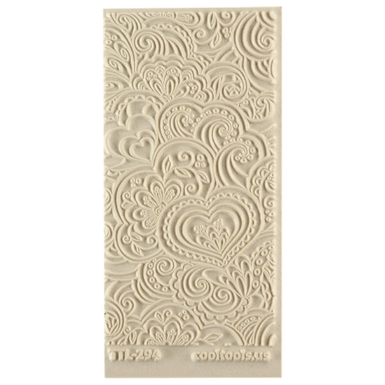 Texture Tile - Blooming Hearts. Beige Texture Tiles are flexible, washable and can be used with any soft clay. Spritz with CoolSlip or dust on Dry Powder Release for stick-free impressions when using metal clay and polymer clay.