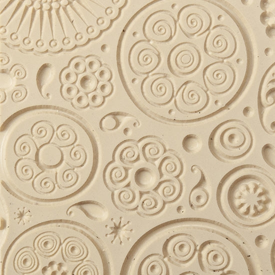 Texture Tile - Astro Embossed. Beige Texture Tiles are flexible, washable and can be used with any soft clay. Spritz with CoolSlip or dust on Dry Powder Release for stick-free impressions when using metal clay and polymer clay.