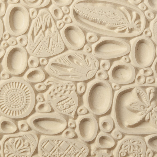 Texture Tile - Pebble Puzzle. Beige Texture Tiles are flexible, washable and can be used with any soft clay. Spritz with CoolSlip or dust on Dry Powder Release for stick-free impressions when using metal clay and polymer clay.