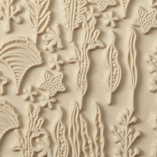 Texture Tile - Seascape. Beige Texture Tiles are flexible, washable and can be used with any soft clay. Spritz with CoolSlip or dust on Dry Powder Release for stick-free impressions when using metal clay and polymer clay.