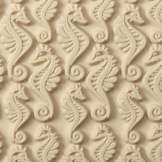 Texture Tile - Dragon of the Sea. Beige Texture Tiles are flexible, washable and can be used with any soft clay. Spritz with CoolSlip or dust on Dry Powder Release for stick-free impressions when using metal clay and polymer clay.