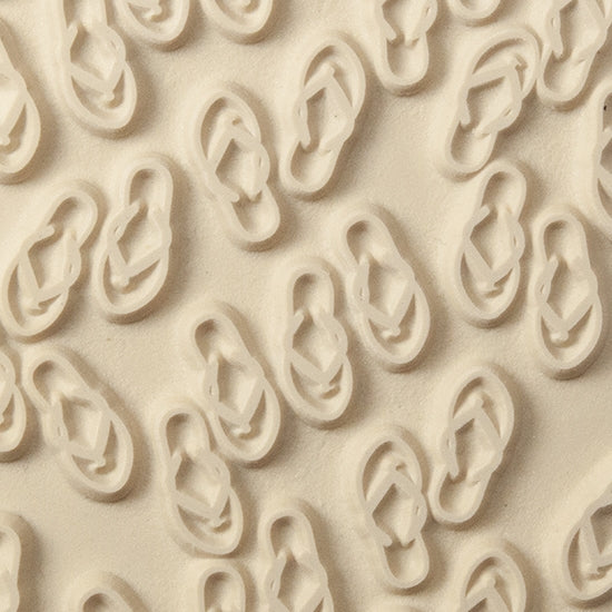 Texture Tile - The Flips and the Flops. Beige Texture Tiles are flexible, washable and can be used with any soft clay. Spritz with CoolSlip or dust on Dry Powder Release for stick-free impressions when using metal clay and polymer clay.