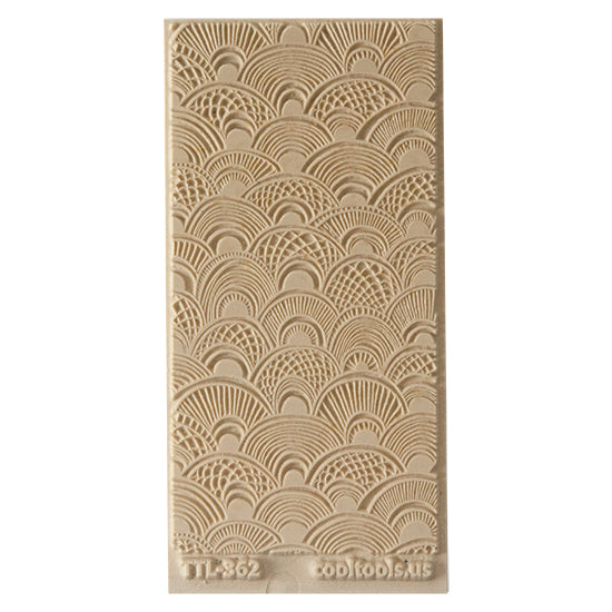 Texture Tile - Seashell Sunrise. Beige Texture Tiles are flexible, washable and can be used with any soft clay. Spritz with CoolSlip or dust on Dry Powder Release for stick-free impressions when using metal clay and polymer clay.